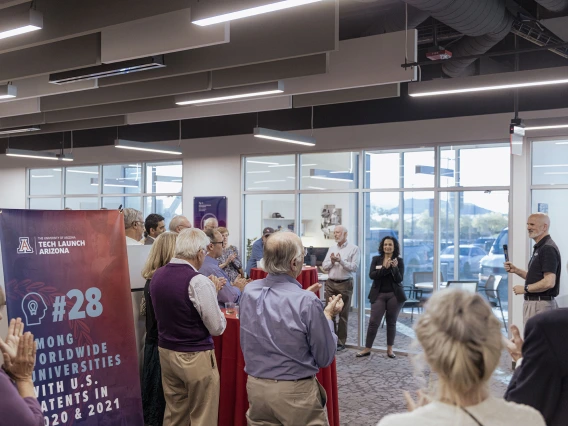 Doug Hockstad announces the UArizona's new patent ranking to the crowd. 