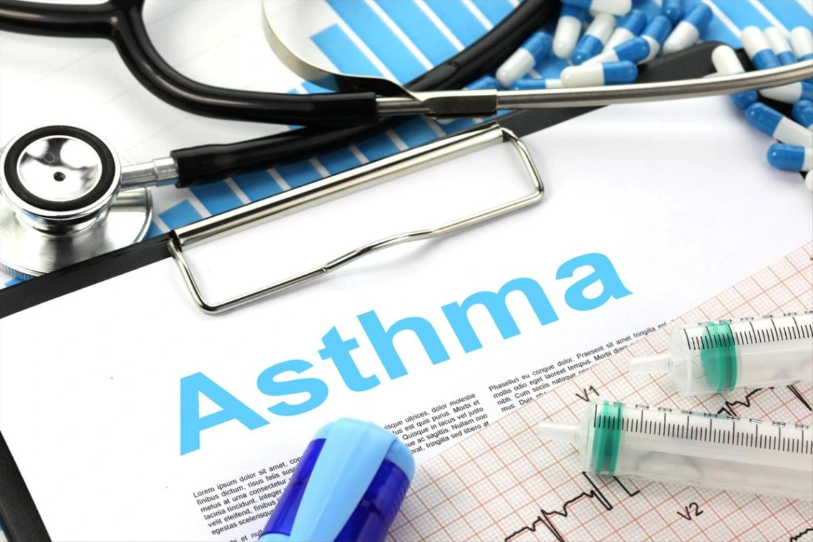 A clipboard with "asthma" and a stethoscope.