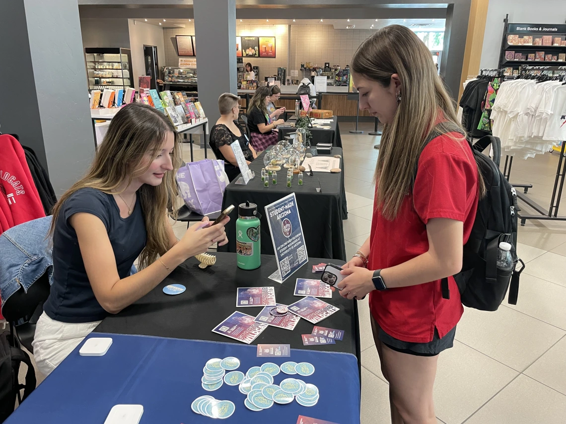 Students selling their crafts at a Student-Made pop-up.