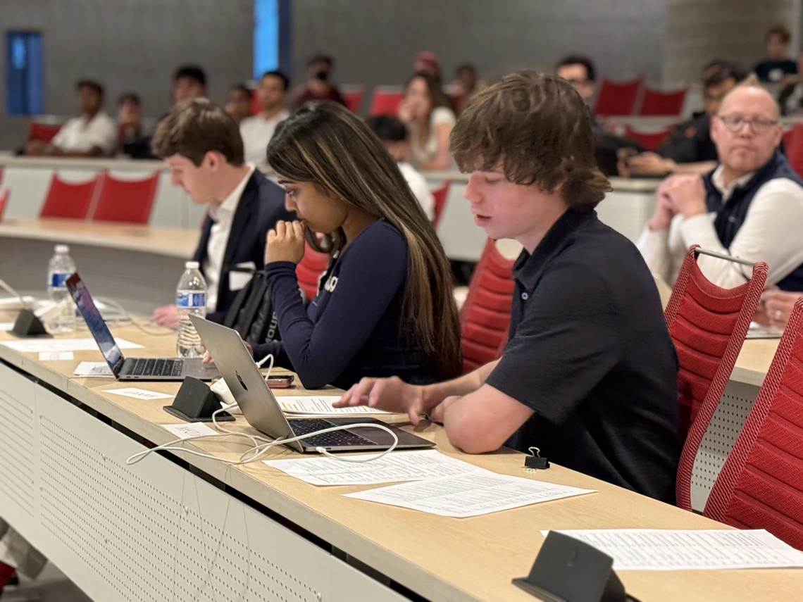 The judges ask questions of the teams who pitch at Startup Night.