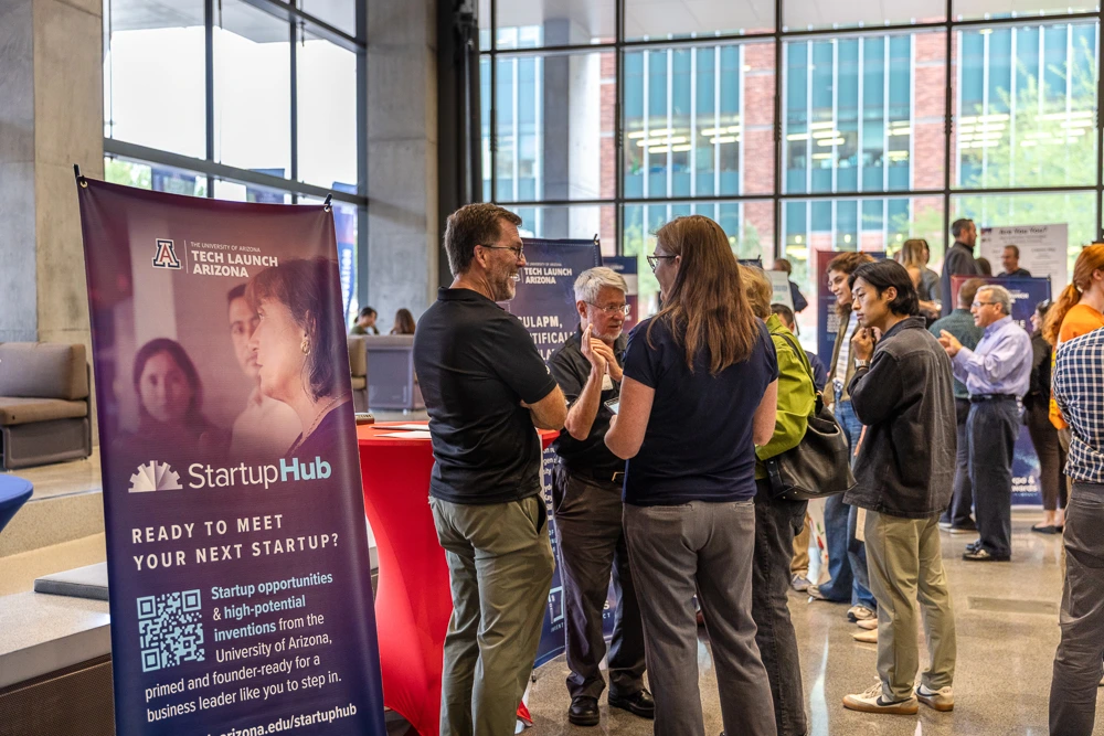 Attendees peruse expo tables at I-Squared 2025.