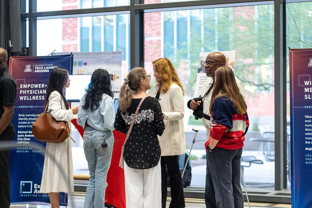 The crowd peruses expo tables at I-Squared. 