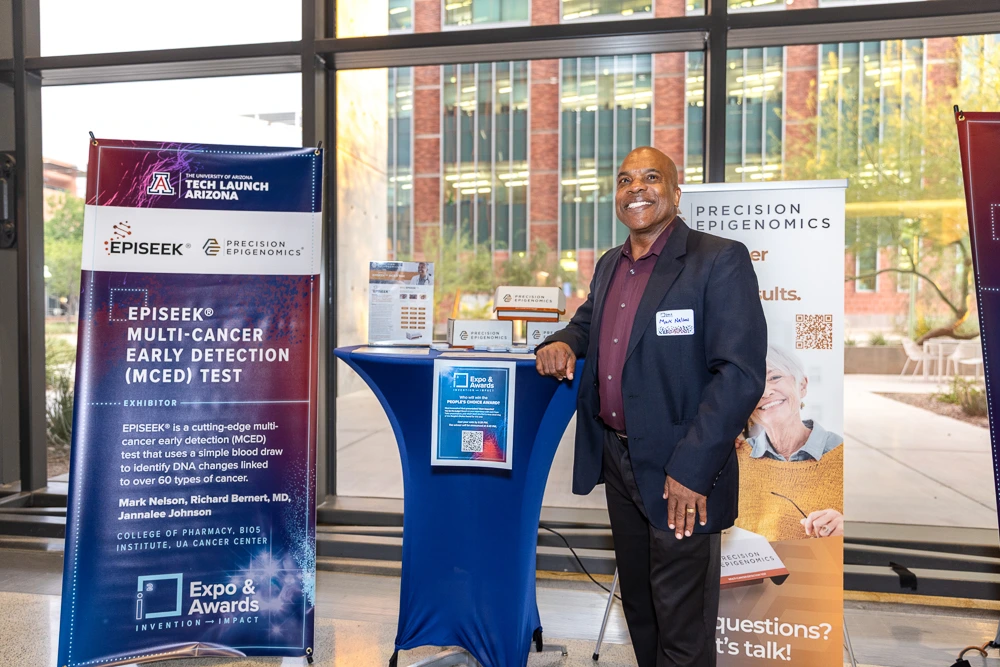 Mark Nelson of Precision Epigenomics at his team's table. 