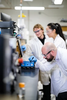 Ph.D. student Anton Samoylov, Yanan Li (now a postdoc at Dartmouth), and Adam Printz, in the lab.